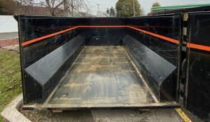 Roll-off dumpster used for heavy renovation waste removal.