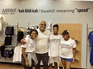 The Haraka co-founders, Jesse and Carol Holland, with their children, Kansas State University student Rita Holland and Dematha Catholic High School senior Jesse Holland III pose in their new store, Haraka Run And Walk, in Hyattsville, Maryland.