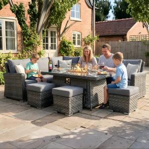 Rattan garden furniture fire pit dining set by Rattan Garden Furniture LTD Essex for outdoor entertaining