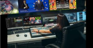 Broadcast control room displaying multiple live television channels with on-screen graphics