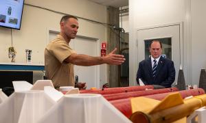 Naval Postgraduate School (NPS) doctoral graduate U.S. Marine Corps Maj. Dillon Pierce completed his dissertation on the rapid development of tactical missile capabilities, briefed Secretary of the Navy John C. Phelan, which then became the topic for a prize challenge.