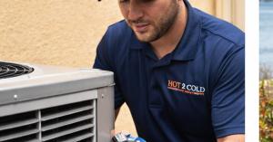 HVAC technician servicing a residential air conditioning system in Apollo Beach, Florida
