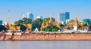 Panoramic view of the Phnom Penh riverside and Royal Palace, showcasing the blend of traditional architecture and modern freehold real estate developments in Cambodia.
