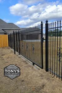 Custom ornamental iron driveway gate installed by Tony’s Fencing & Iron Works at a Southeast Louisiana residence