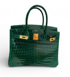 Hermès Birkin 30 Emerald Shiny Niloticus Crocodile Handbag Lena of Goldpawnership sold for a record $38,999.  Goldpawnership also sells Louis Vuitton, Chanel, Hermès, Prada, Gucci, Saint Laurent, Goyard, Tiffany & Co., Tom Ford and Celine brands. 