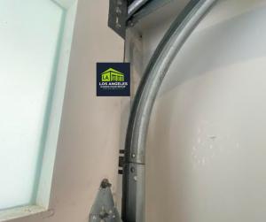 A close-up of a LiftMaster smart garage door motor being installed by a Los Angeles technician.