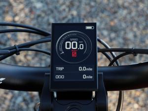 Optibike G2 Loki handlebar-mounted color display showing speed and boost level
