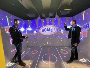 Visitors experience NEWJAK’s XR interactive sports content ‘SPORTRACK’ at the CES 2026 exhibition.