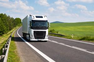 White truck driving on the road