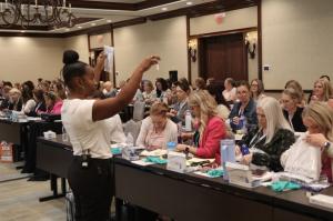 Dr. Joy Void-Holmes leads an interactive clinical workshop with dental professionals, showcasing her P3 Clinical Methodology™ for improving hygiene systems and delivering high-level patient care.