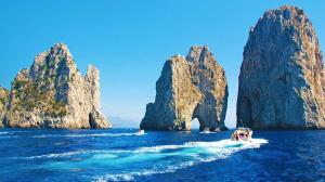 Motorboat Cruising towards Faraglioni of Capri Island