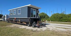 Oversized Houseboat being transported.