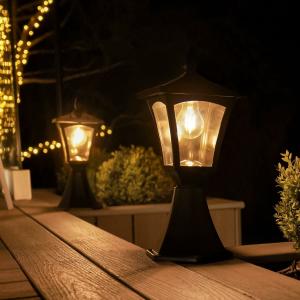 Solar garden lights illuminating wooden deck at night