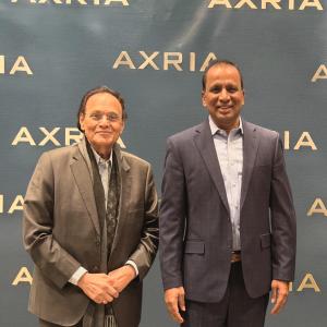 Dr. Dattatreyudu Nori standing alongside Chandra Mandalapu, Chief Executive Officer of Axria, during a community gathering, reflecting their long-standing professional and personal association.