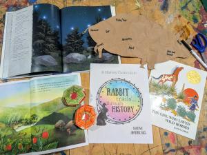 Layout of the new Native Americans unit from Rabbit Trails, including the title cover, picture books, and crafts from children who have used the curriculum.