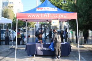 A Los Angeles Trial Lawyers Charities volunteer helping an LA Resident at their Day of Dignity which will be at The Center in Hollywood on Saturday, February 7, 2026