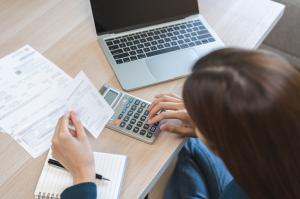 Gen Z woman calculating budget