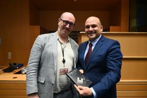 MEP Peter Agius is presented with Daniel Thompson-Yvetot's latest book in the European Parliament