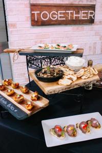 Chef Serge Krikorian's four winter party appetizers showcased on THV11's The Vine, including (clockwise from top) smoked salmon on cucumber rounds, sautéed mushroom crostini with whipped ricotta, peppered beef tenderloin crostini, and twice-baked potato b