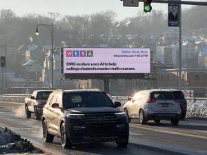 One of many billboards around Pittsburgh displaying WESA local news headlines.