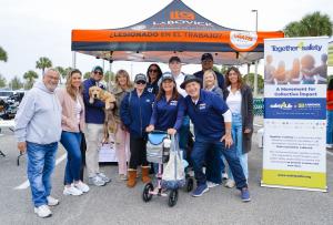Safety 4 Life and LaBovick Law Group representatives with community members at a Safety Fair focused on teen driver safety and prevention.