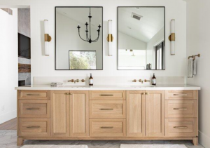Double vanity with light wood shaker cabinets and gold hardware from Las Vegas Wholesalers Kitchen and Bathroom Cabinet Center, voted best wholesale kitchen cabinet showroom in Las Vegas, Summerlin, and Henderson.