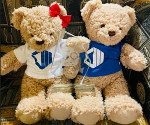 Two teddy bear mascots wearing ProServeIT shirts holding the Canada’s 50 Best Managed IT Companies Award, symbolizing the company’s people‑focused managed IT services.