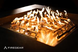 Firegear ProSeries Snowflake Pro Brass gas fire pit burner system featuring high-quality brass construction and active flames.