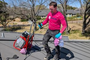 Mother Modern Plumbing's Master Plumber prepares for hydro jetting service with equipment in Fort Worth TX