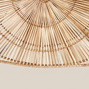 Rattan pendant light over dining table in restaurant