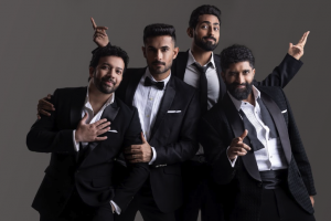 Four members of Indian pop-rock band SANAM posing in black suits during promotion for the SANAM North American Tour 2026.