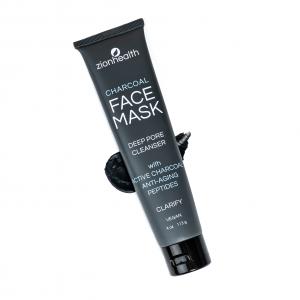 Black tube of Zion Health Charcoal Face Mask – Deep Pore Cleanser with activated charcoal and anti-aging peptides, displayed against a light background with charcoal texture behind the product.
