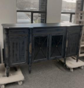 Effortless distinction. This Regency-style buffet features glass-paneled doors, turned columns, and a distressed navy blue finish. A statement piece for dining rooms with personality.