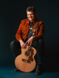 Alex Miller ( 7099 sitted, smile, gtr ) by Stephen Johnson