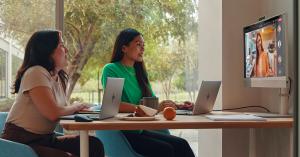 Two people in conference room on a video call