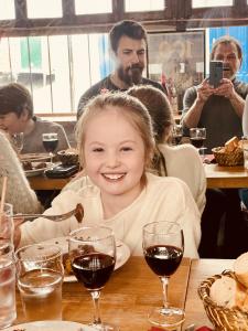 A young woman enjoying beef on our Paris Tour