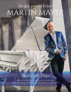 Cover of 'The Solo Piano Collection' Album Sheet Music book by Martin Mayer — featuring Martin Mayer leaning against a white sculptural Fazioli grand piano in a blue floral blazer, with the subtitle 'Songs from The Solo Piano Collection, arranged and nota