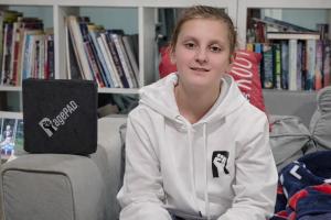 Maxim Harris with a Black RagePAD on a couch