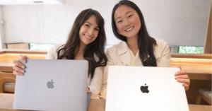 Alexis Schomer and Jenna Henao working on laptops