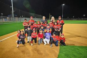 Víctor D. Treviño and his wife, Rosa Márquez de Treviño, joined the Alpha Dogs—among the many teams in attendance—and their coach at the grand opening of the Buena Vista Sports Complex in Laredo. Courtesy Image City of Laredo, Texas.