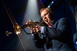 Carl Fischer’s Sunshine City Brass will headline this March outing for the Tampa Jazz Club as part of the HC Sunday Jazz Series at the Mainstage Theatre at HC Ybor on Sunday, March 8 at 3:00 PM Carl Fischer playing flugelhorn on stage with Billy Joel