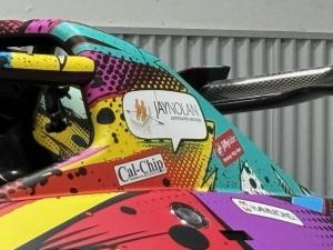 Close-up of the Jay Nolan Community Services logo on the side of Austin Riley's 2026 racecar.