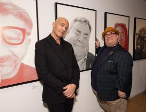 Billy Zane and Joshua Gogarty in front of Billy Zane's exhibit, 