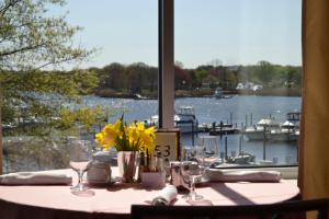 Table overlooking marina with flowers and set for brunch