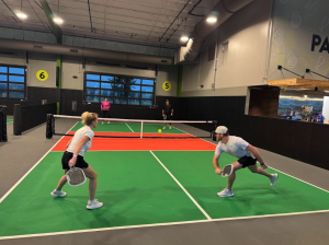 Sydney and Mason playing pickleball
