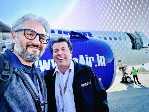 a photo of Steve Giordano and Bob Allen standing in front of an A320-NEO engine nacelle