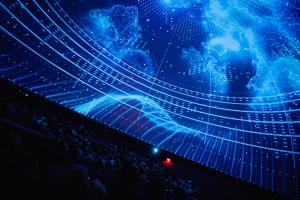 Audience sits back in a planetarium and watches a fulldome film on the ceiling.