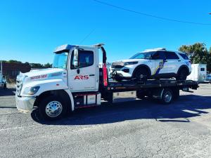 ARS Towing flatbed truck with company branding providing 24/7 roadside assistance and vehicle recovery services in Southampton, PA.