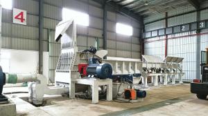 Processing recycled wood waste, such as shipping pallets, presents unique challenges