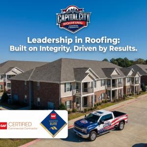 Image of a multi-family apartment complex with a branded truck from Capital City Roofing located in Alpharetta, GA, with the tagline